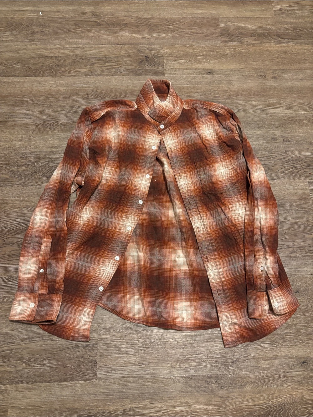 men’s orange and brown button down shirt